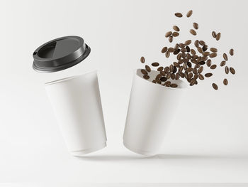 Close-up of coffee cup over white background