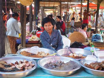 People at market stall