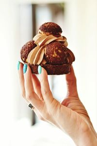 Close-up of hand holding ice cream