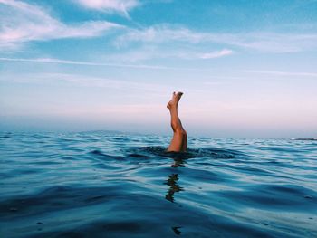 Woman swimming in sea