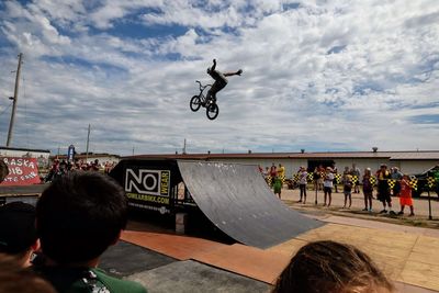 People jumping against the sky