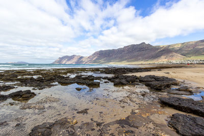 Scenic view of beach against sky