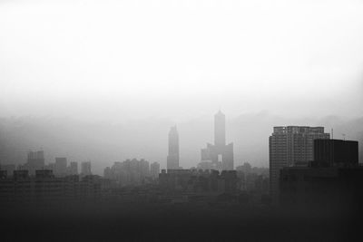 Modern buildings in city against sky