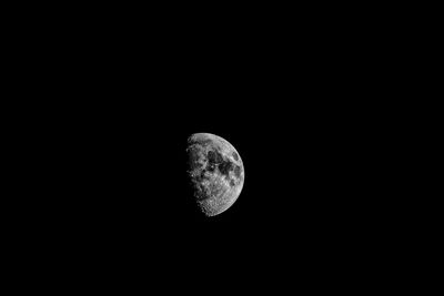 Low angle view of moon against sky at night