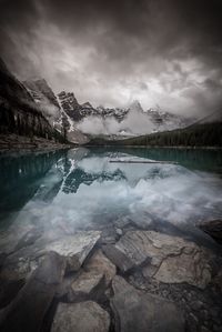 Scenic view of lake and mountains against sky