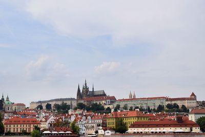 Houses in town against sky