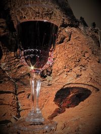 Close-up of wine glass on rock