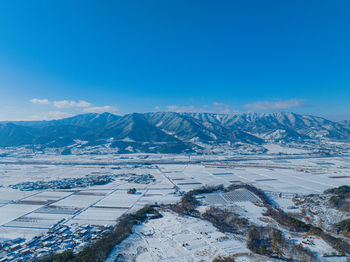 Aerial view of townscape against sky