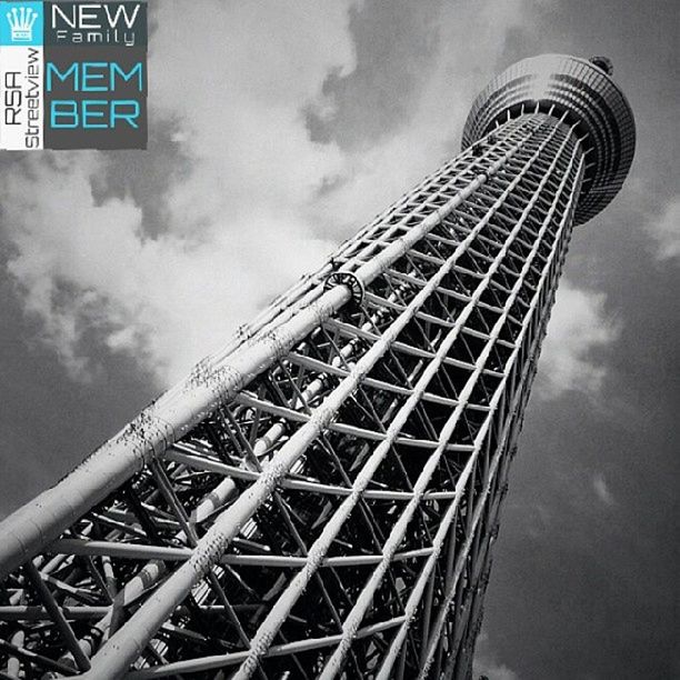 architecture, low angle view, built structure, sky, tall - high, tower, cloud - sky, building exterior, cloudy, travel destinations, metal, city, communication, capital cities, famous place, international landmark, communications tower, cloud, modern, tall