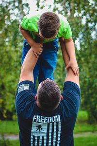 Rear view of father and son