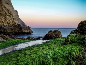 Scenic view of sea against sky at sunset