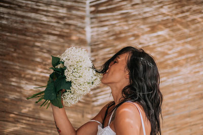 Woman holding flower bouquet