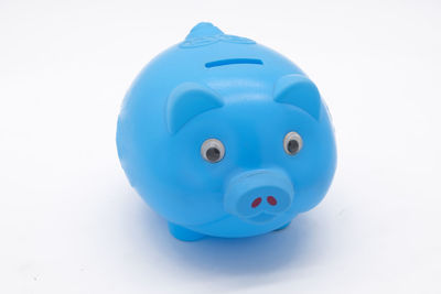 Close-up of blue toy against white background