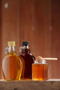 Close-up of honey in jars on table