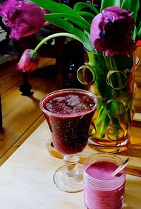 Close-up of beer in glass vase on table