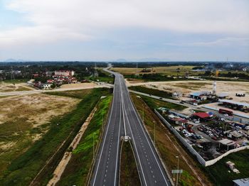 High angle view of highway in city against sky