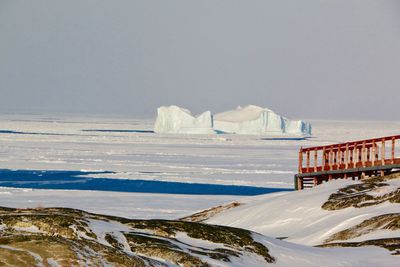 Scenic view of frozen sea against clear sky