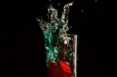 Close-up of splashing water against black background