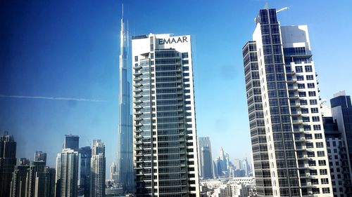 Low angle view of buildings in city against sky