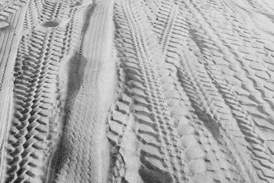 Full frame tire tracks on sand dune