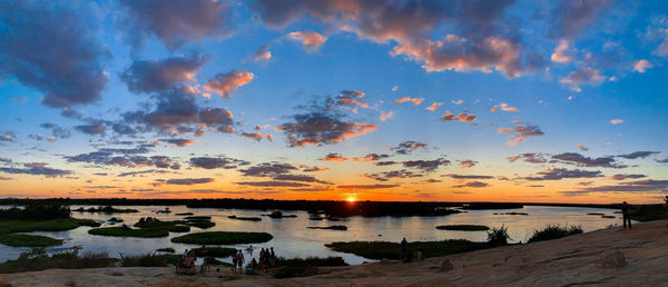 Scenic view of beach against sky during sunset