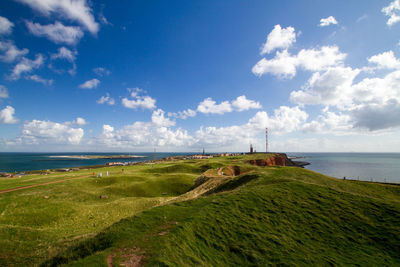 Scenic view of sea against cloudy sky