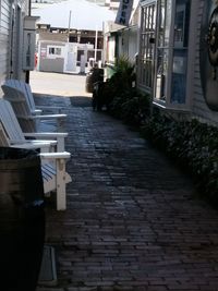 Cobblestone street amidst buildings in city