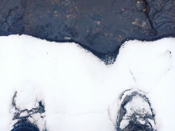 Person covering face on white background