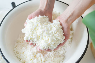 Cropped hand of person preparing food