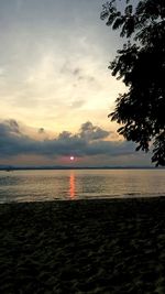 Scenic view of sea against sky at sunset