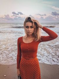 Young woman standing at beach