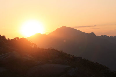 Scenic view of mountains against sky during sunset