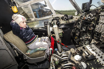 Portrait of boy sitting in bus