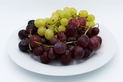 High angle view of fruits in plate on table