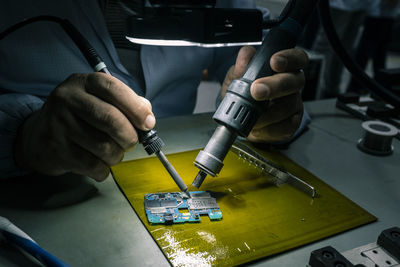 Close-up of man working on table