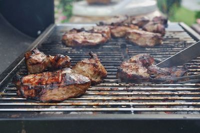 High angle view of meat on barbecue grill