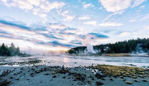 Scenic view of lake against dramatic sky