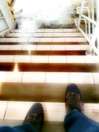 Low section of man standing on floor