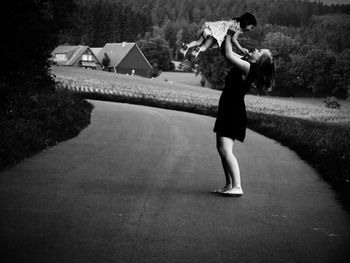 Full length of young woman standing outdoors