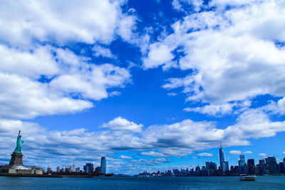 City skyline against cloudy sky