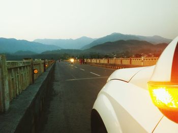 Road in city against clear sky