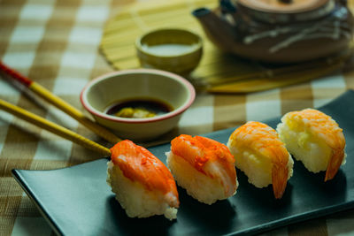 Close-up of sushi served on table