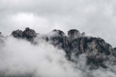 Low angle view of majestic mountain against sky