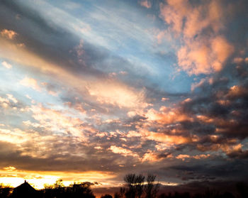 Low angle view of dramatic sky during sunset
