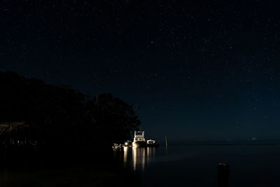 Illuminated building against sky at night