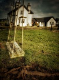 Abandoned structure on grassy field