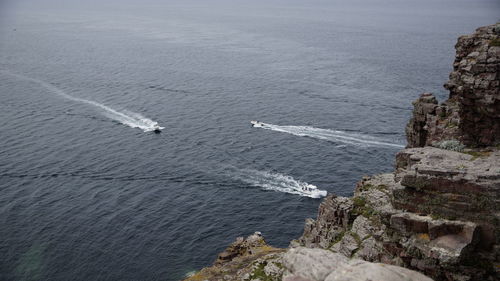 High angle view of rocks by sea