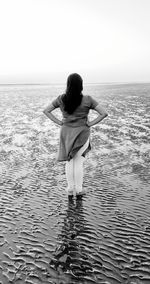 Rear view of woman on beach