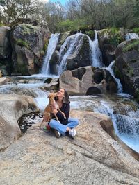 Rear view of man climbing on rock