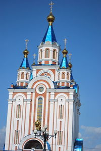 Low angle view of building against blue sky